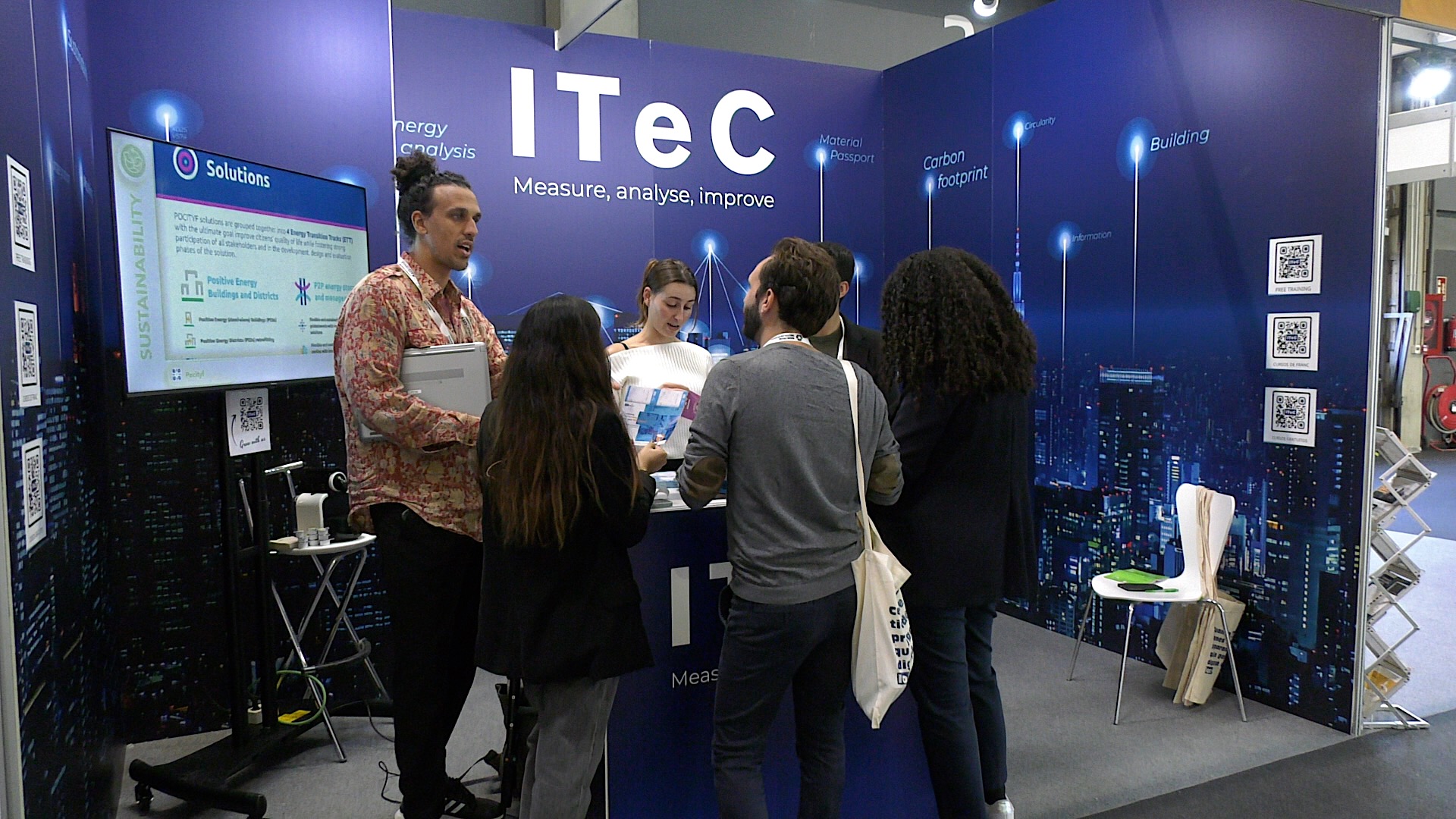 IteC stand with some people