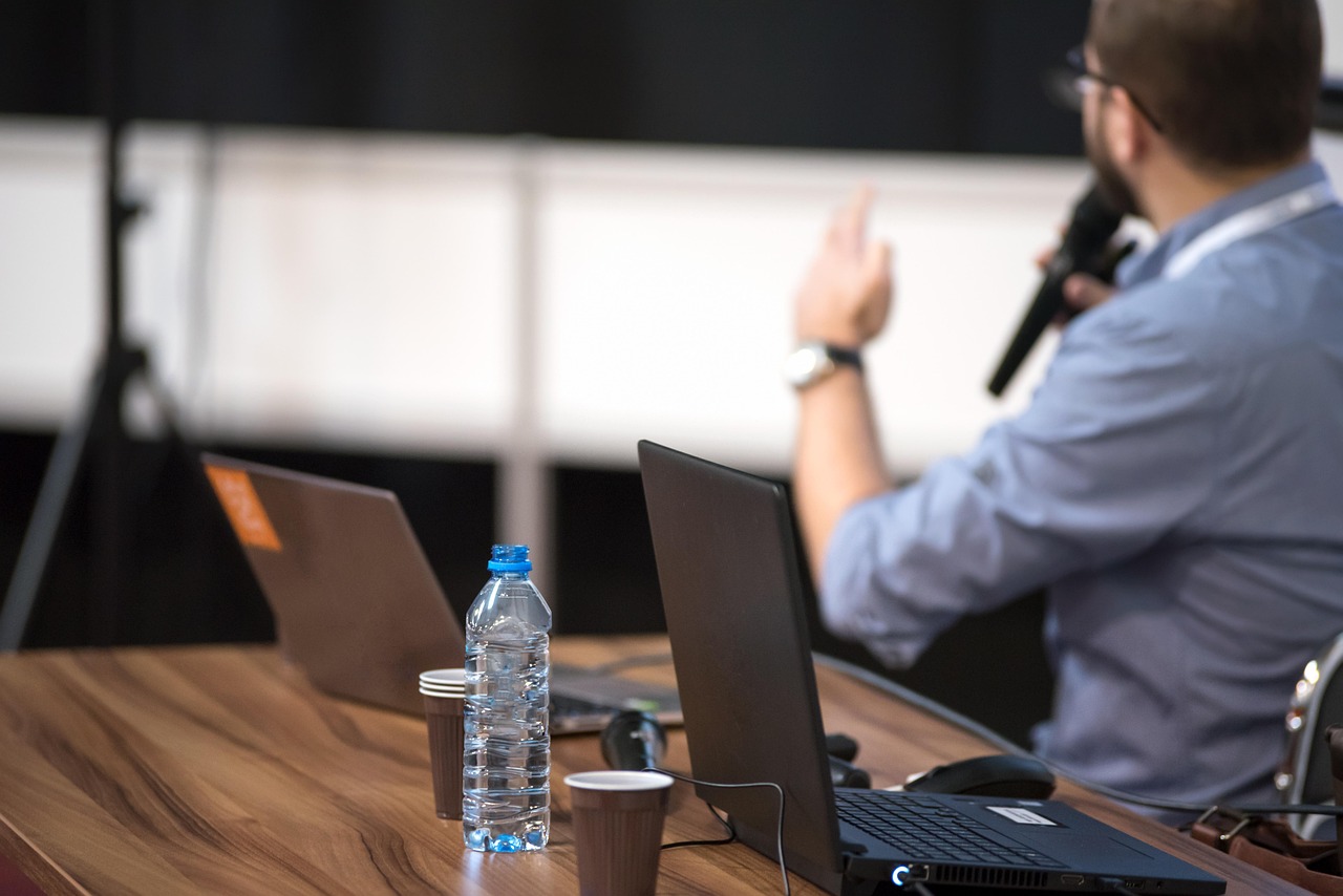Person speaking at a conference