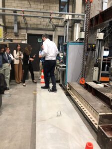 Guy walking on concrete panel in lab