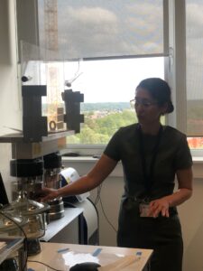 Woman scientist showing lab machinaries