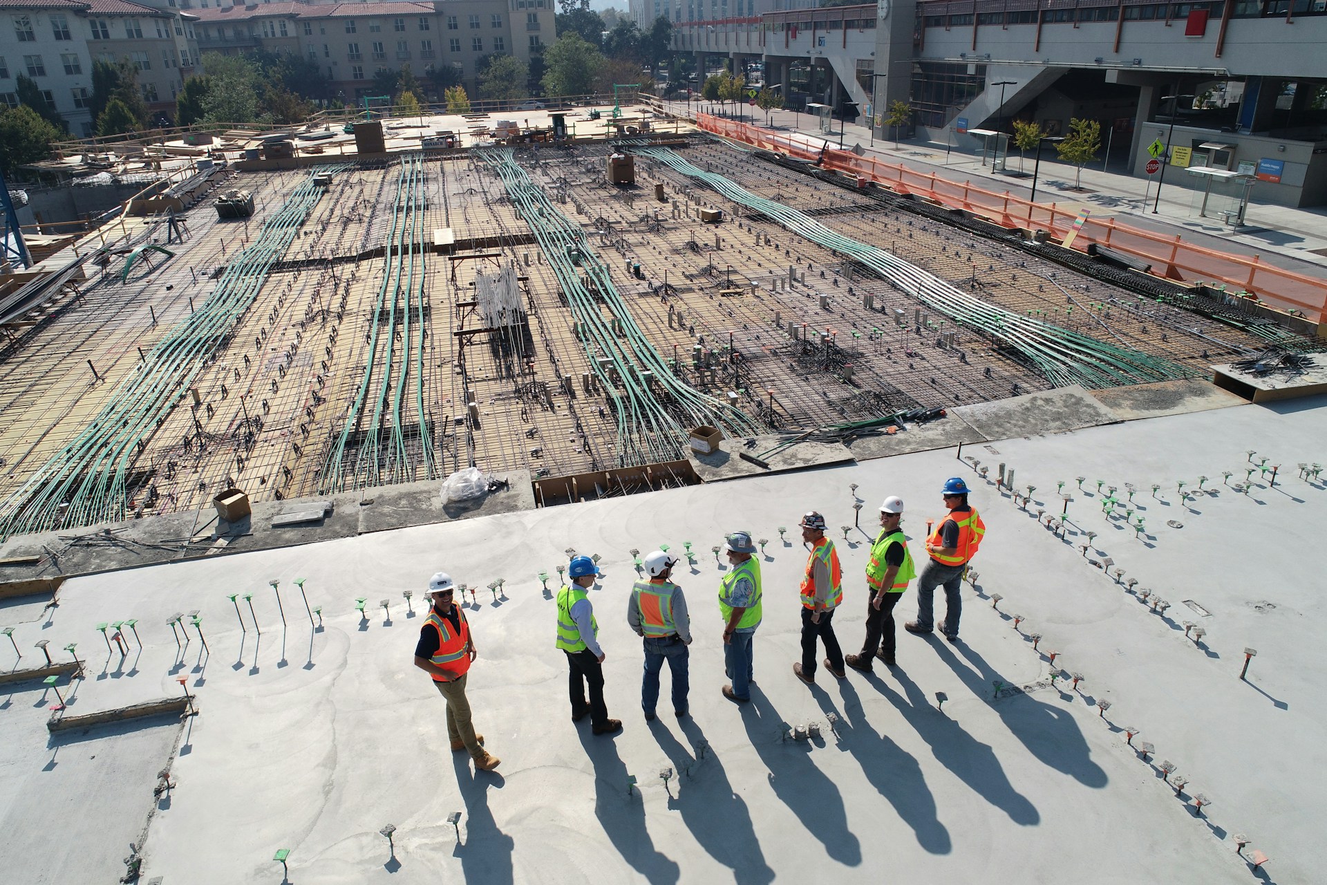 Construction workers in front of construction site