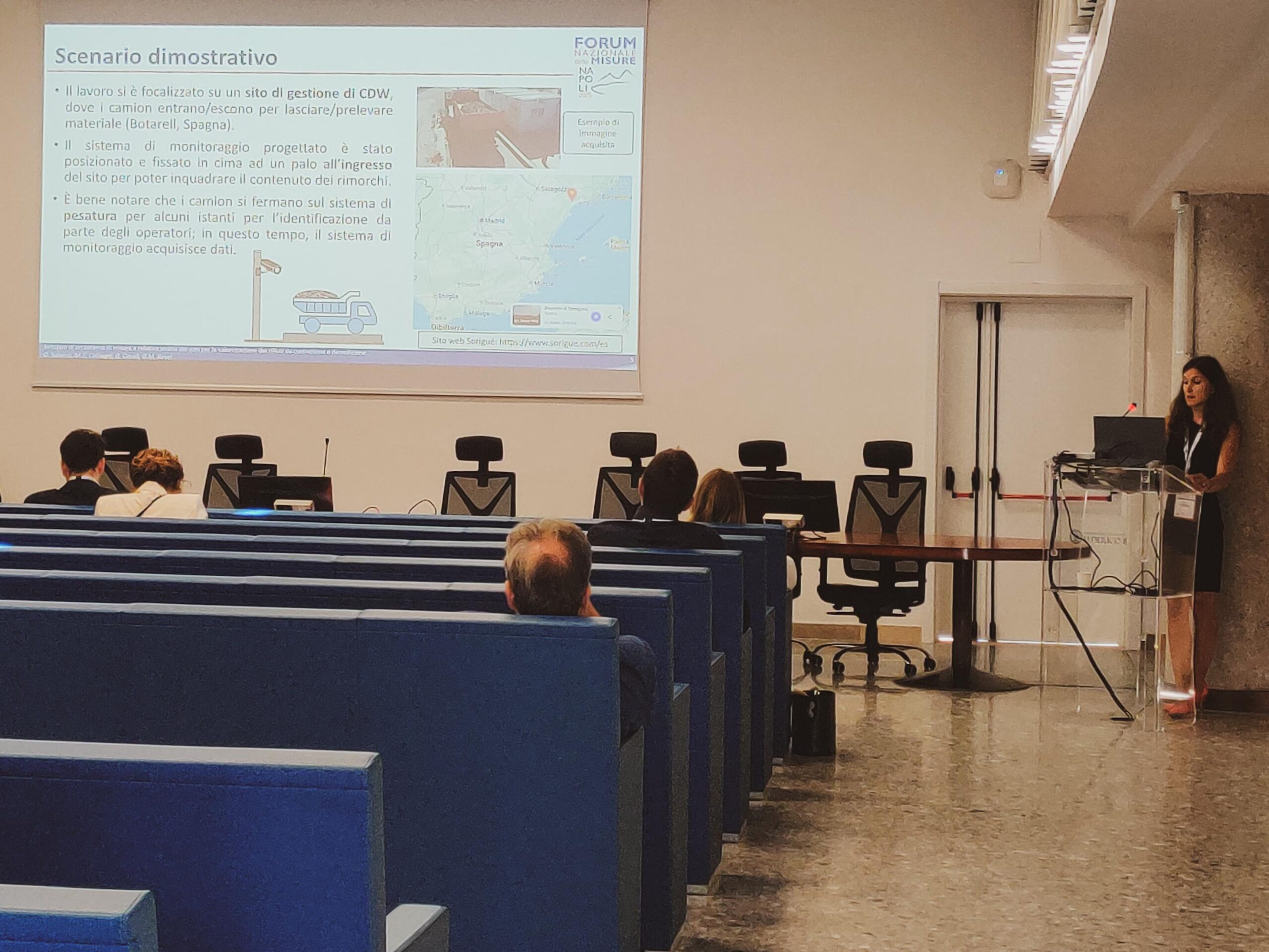 Prof Gloria Cosoli presenting in a lecture room at a conference